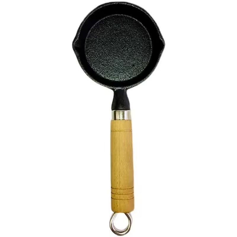 Oljesprutede nudler skje hot pot mini støpejern kokt olje oljefarget liten jerngryte